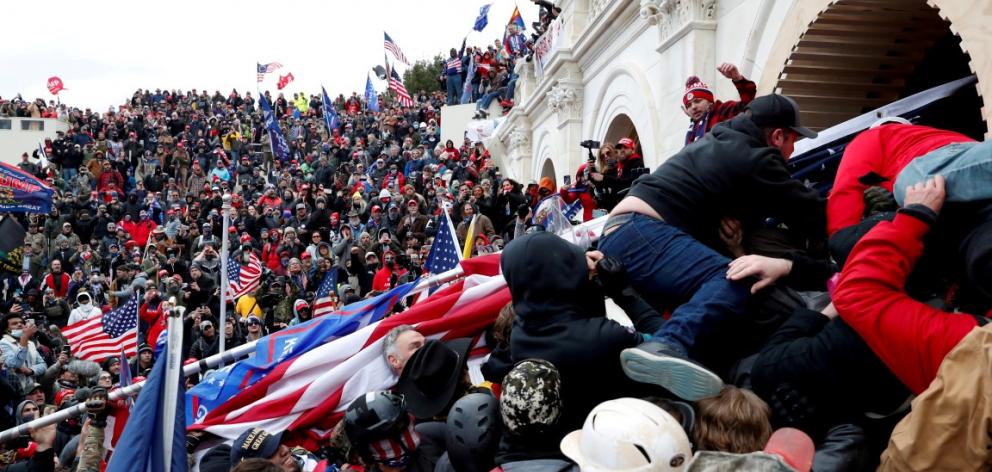 Rioters stormed the Capitol on January 6, sending lawmakers into hiding and leaving five people...