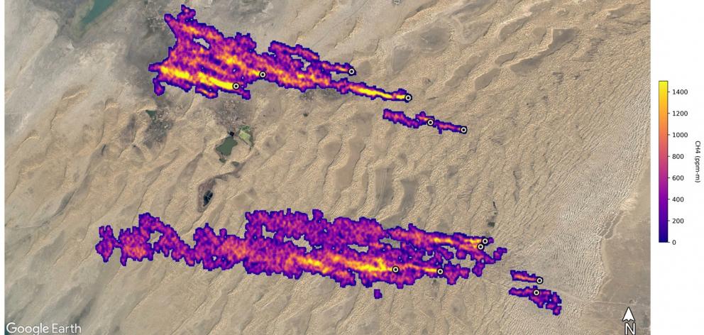 Twelve plumes of methane shown east of Hazar in Turkmenistan overlaid on a satellite photo...