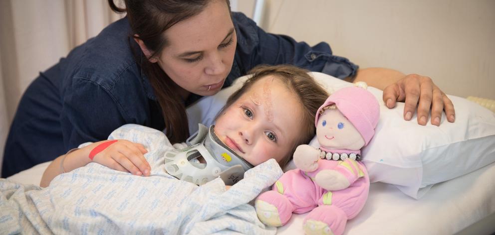 Nirvana recovers in Christchurch Hospital watched over by her mother Nicole Badman. Photo: NZ Herald