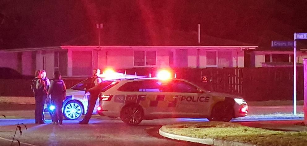 Police at the scene on Hoani Street, Northcote, late last night. Photo: Dylan Smits

