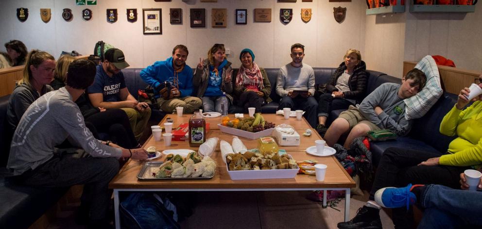 Evacuees formerly stranded in  Kaikoura rest aboard the New Zealand naval ship HMNZS Canterbury....