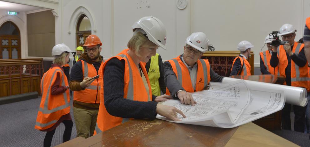 Amy Adams and Richard Johnston of Amalgamated Builders review plans in the Dunedin District Court...