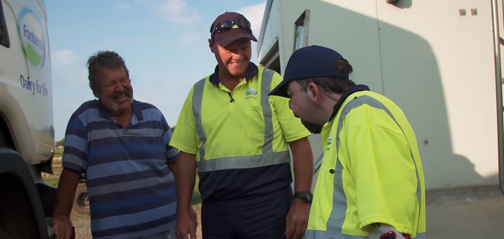 Andrew greets a Fonterra driver (centre) with dad Kevin. Image: RNZ