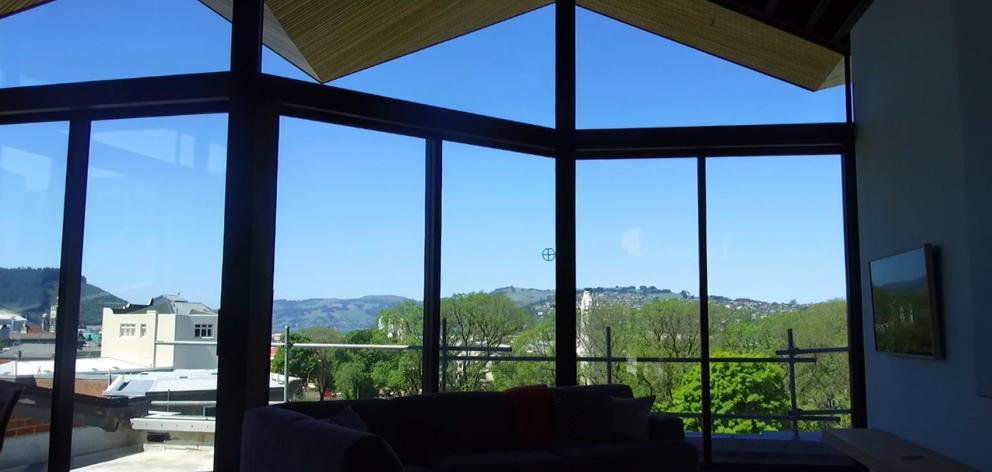 Floor to ceiling glass captures views of First Church, Queens Gardens and the warehouse precinct.