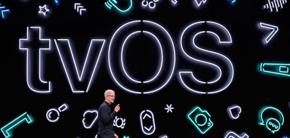 Apple CEO Tim Cook says its AppleTV operating system will work with Microsoft Xbox and Sony Corp PlayStation video game controllers. Photo: Reuters