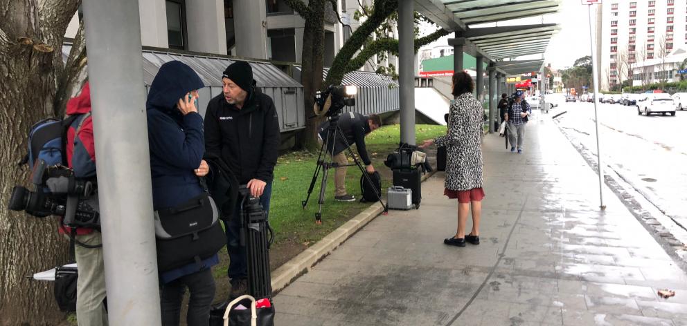 Media from different news agencies covering the birth of the Prime Minister's baby gather outside Auckland Hospital. Photo: Debbie Porteous