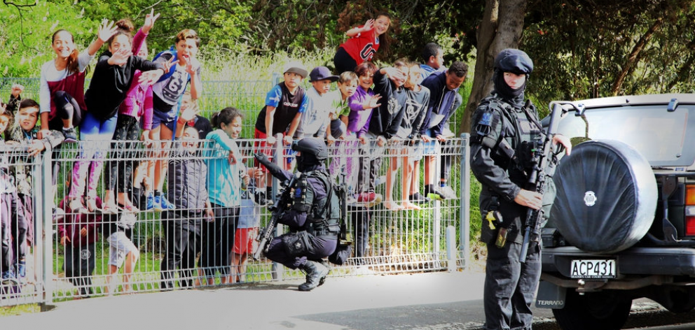 Armed police outside Tawhero School. Photo: Stuart Munro