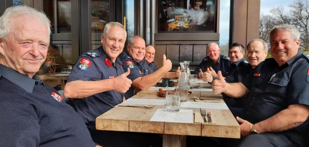 Des Syme (left) celebrates 65 years of service at a luncheon with Fire and Emergency New Zealand...