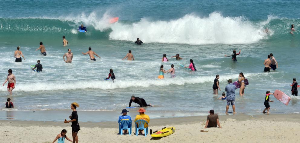 Crowds pack into the surf at St Kilda Beach in Dunedin. Temperatures hit the 30s last week. Photo...