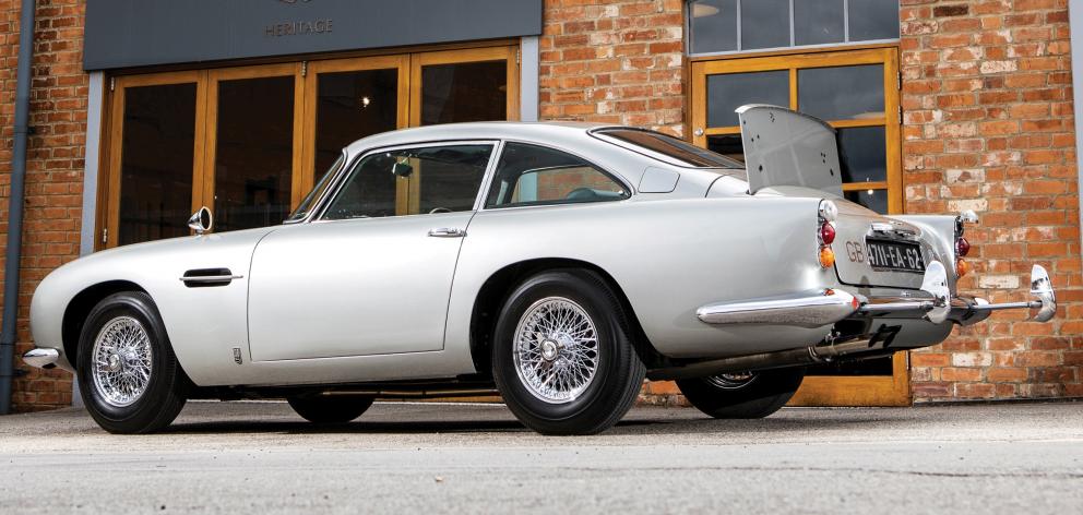 An original Aston Martin DB5 car, one of just three surviving examples, fitted with James Bond...