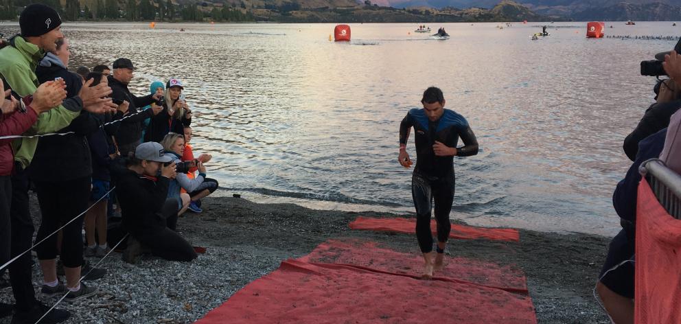 Christchurch triathlete Dylan McNeice leads the field out of Lake Wanaka at the end of the swim...