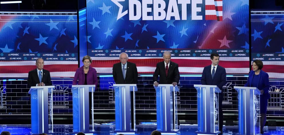 Mike Bloomberg, Senator Elizabeth Warren, Senator Bernie Sanders, former Vice President Joe Biden, former South Bend Mayor Pete Buttigieg and Senator Amy Klobuchar participate in the ninth Democratic debate. Photo: Reuters