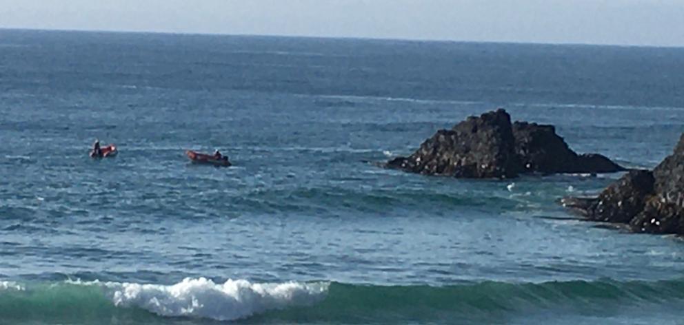 Surf life savers in IRBs continue their search this morning. Photo: Stephen Jaquiery
