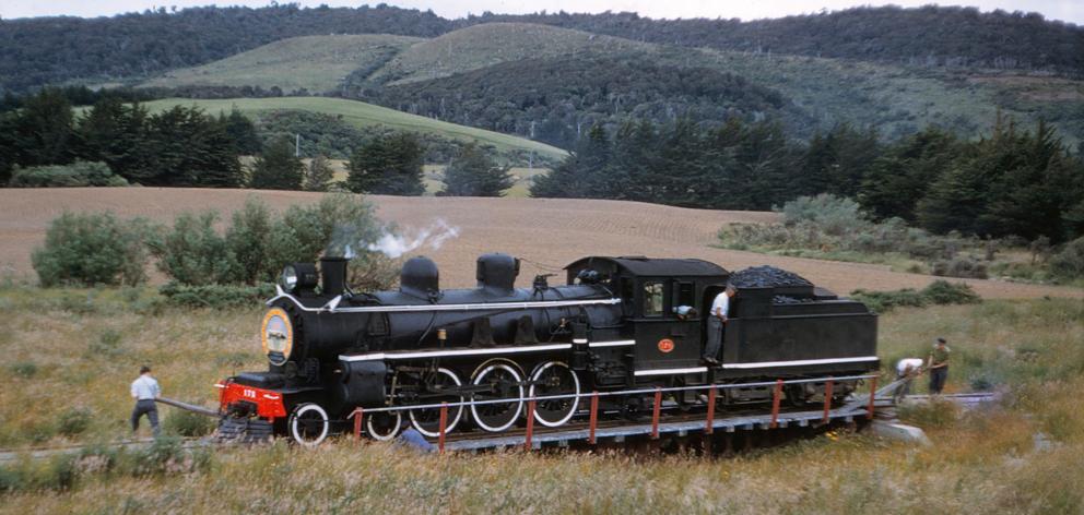 Railway workers shift the train around at the end of the line turntable at Tokanui in 1960.PHOTO:...