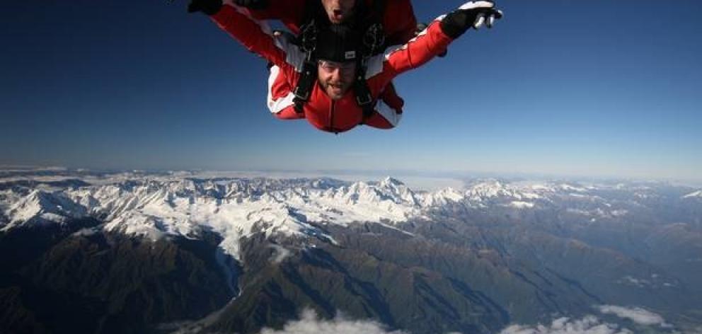 Skydivers and a helicopter were briefly on a collision course over Franz Josef Aerodrome in...