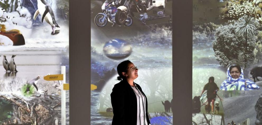 Otago Museum planetarium producer Oana Jones visits the museum’s  Beautiful Science Gallery, which has  just won a national award and includes extensive use of Otago Daily Times photographs. Photo by Peter McIntosh