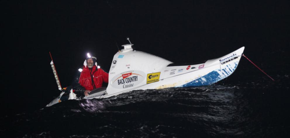 Scott Donaldson has rolled three times during the night and is like 'a dice in a cup' as the waves batter his kayak.