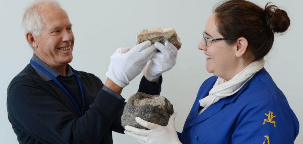 Otago Museum honorary geology curator Dr Tony Reay holds a chunk of pink silica rock, from near the destroyed Pink and White Terraces, and Otago Museum natural history research and interpretation co-ordinator Emma Burns holds a lava bomb flung out during Otago Museum honorary geology curator Dr Tony Reay holds a chunk of pink silica rock, from near the destroyed Pink and White Terraces, and Otago Museum natural history research and interpretation co-ordinator Emma Burns holds a lava bomb flung out during