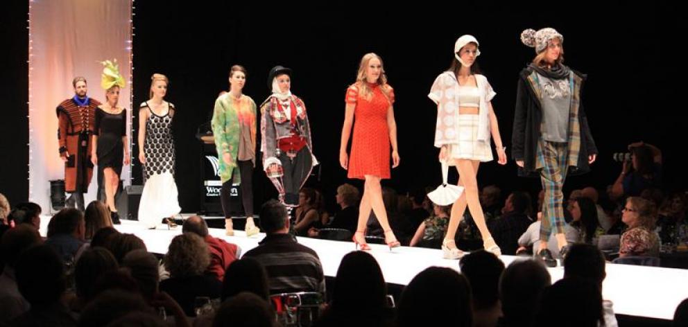 Models wearing the winning designs from each of the eight categories in the WoolOn creative fashion event take one last walk down the runway. Heather Kerr's supreme award creation is second from right. Photo by Leith Huffadine.