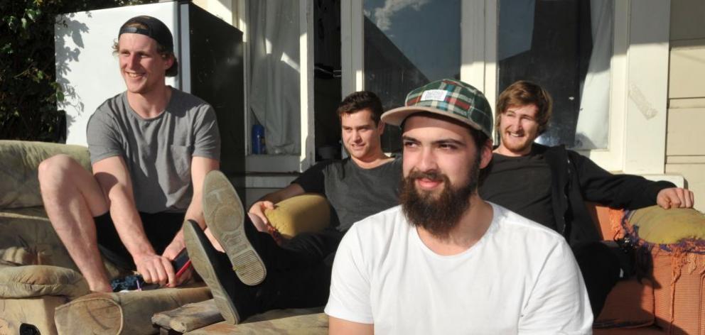 Dunedin Thunder team members Connor Harrison, Luke Pickering, Aston Brookes and Mitchell Frear (in front) relax at their Hyde St flat before the New Zealand Ice Hockey League final tonight. Photo by Gregor Richardson.