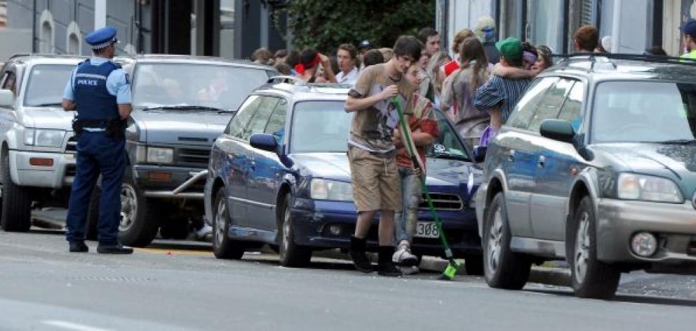 Police attend a large student party on Stafford St, Dunedin,  yesterday. Photo by Craig Baxter.