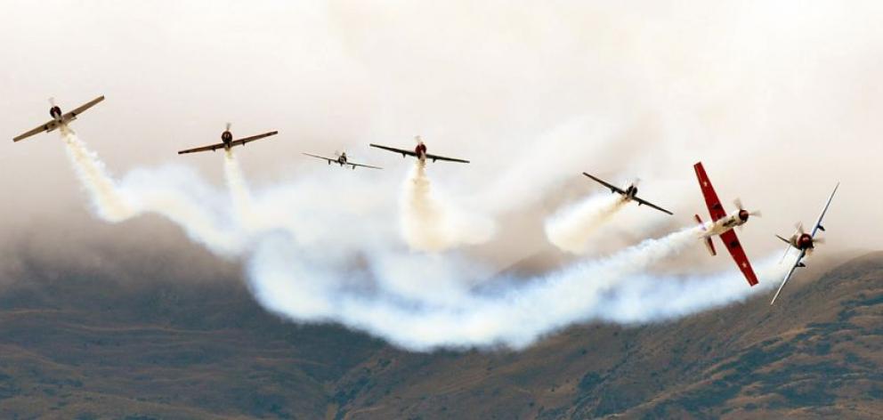 The Yak 52 team perform a starburst move. Photo by Stephen Jaquiery.