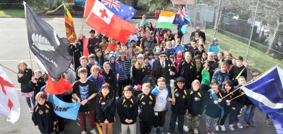 Arthur Street School pupils march around the school in a mock Commonwealth Games opening ceremony yesterday. 