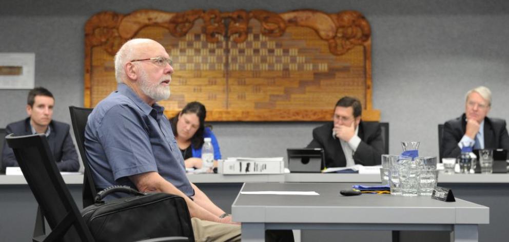 Robert Wyber calls for more co-ordination of bus services as Otago Regional Council staff listen during the draft regional public transport plan hearing at the regional council's council chamber yesterday. Photo by Gregor Richardson. 