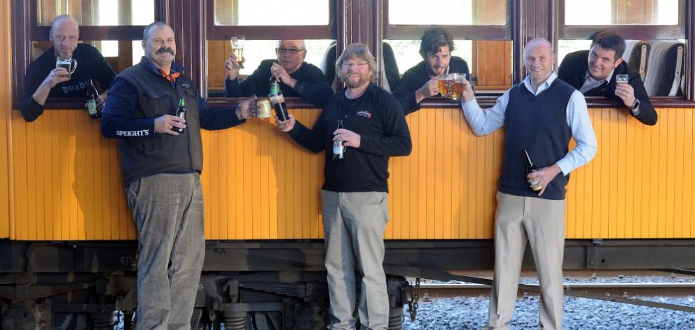 Craft beer brewers (from left) Kelly Lindsay (of Green Man), Dennis Trembath (of Speight's), Gavin Duff (of McDuffs), Richard Emerson (of Emerson's), Bart Acres (of Velvet Worm), Dunedin Craft Beer Expo organiser Matthew Black and Taieri Gorge Railway bus
