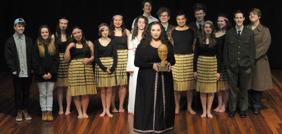 Logan Park High School pupil Reva Grills (17), and the cast, with the Sheilah Winn Award won by the school for its performance of Othello at the New Zealand Sheilah Winn Shakespeare Festival. Photo by Gregor Richardson. 
