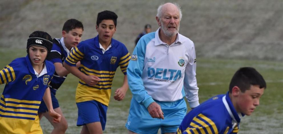 Referee Mark Walton referees a match between the Kaikorai and Taieri under-13 sides at Bishopscourt on Saturday with players (from left) Dylan Williams, Ben Joseph, Montell Moses and Finn McDonald-Page. PHOTO: GREGOR RICHARDSON