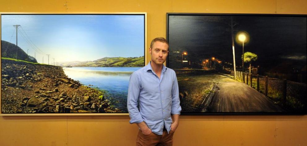 Dunedin artist Sam Foley with two of the artworks in his coming exhibition. Photo by Gregor Richardson.   