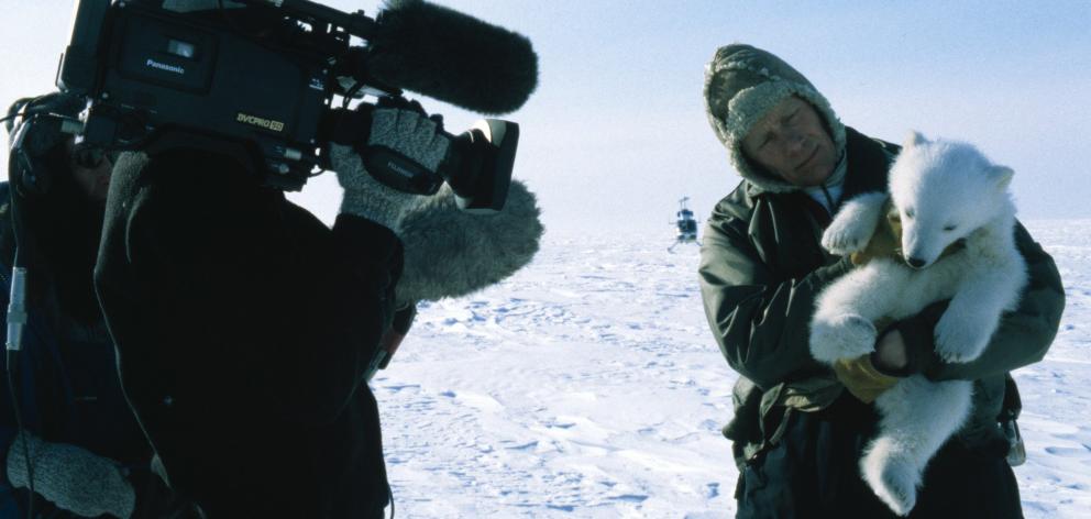  Quinn films research scientist Steve Amstrup and a polar bear cub on the Arctic sea ice. PHOTO: SUPPLIED 