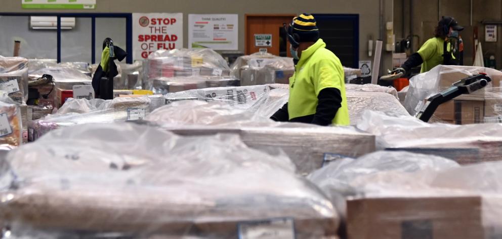 Foodstuffs workers prepare orders for the lower South Island’s supermarkets. PHOTO: CRAIG BAXTER
