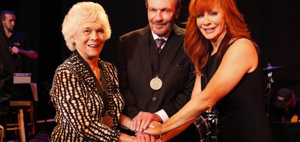 Jean Shepard (left) with Bobby Braddock and Reba McEntire in 2011. Photo: Getty Images 