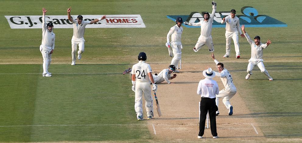 Tom Latham took a late catch off Mitchell Santner's to dismiss nightwatchman Jack Leach and leave...