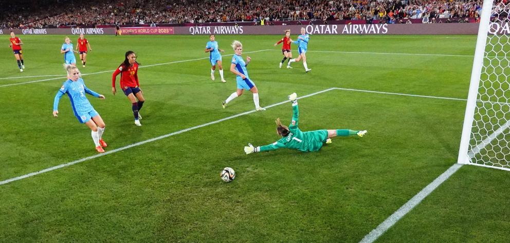 Spain’s captain Olga Carmona scores the winning goal past England keeper Mary Earps.