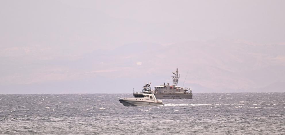 Coastguard boats searching for the six people missing after a yacht sank off the coast of...