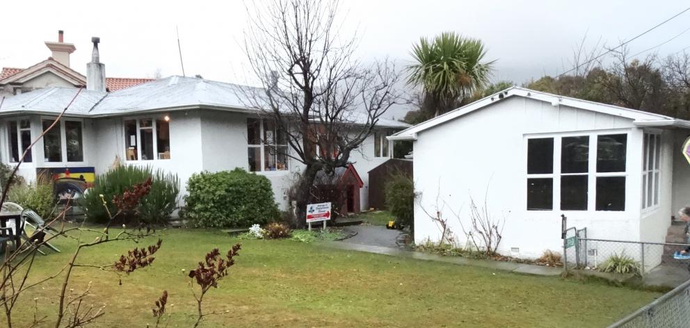 Queenstown’s Happiness House (left) yesterday sold at auction for $2.213 million. PHOTO: DAVID...