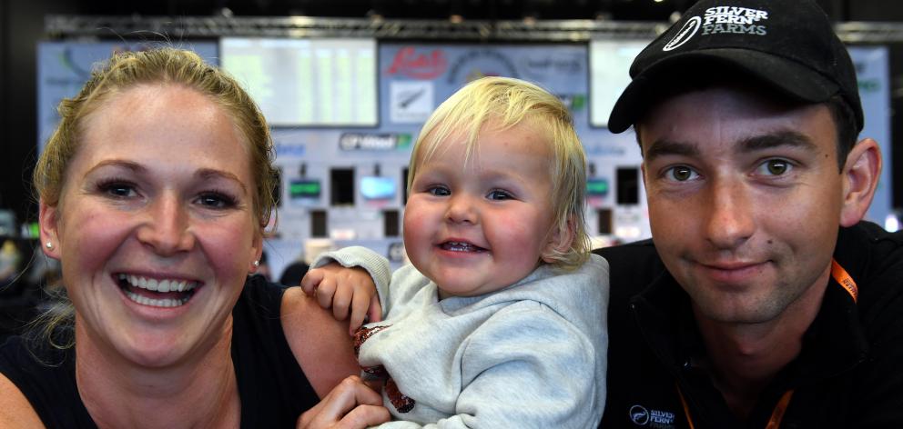 Shearer Brya Harrison-Kyle with husband Chris Kyle and daughter Lucie at the World Shearing and Woolhandling Championships in Invercargill yesterday. Photo: Stephen Jaquiery.