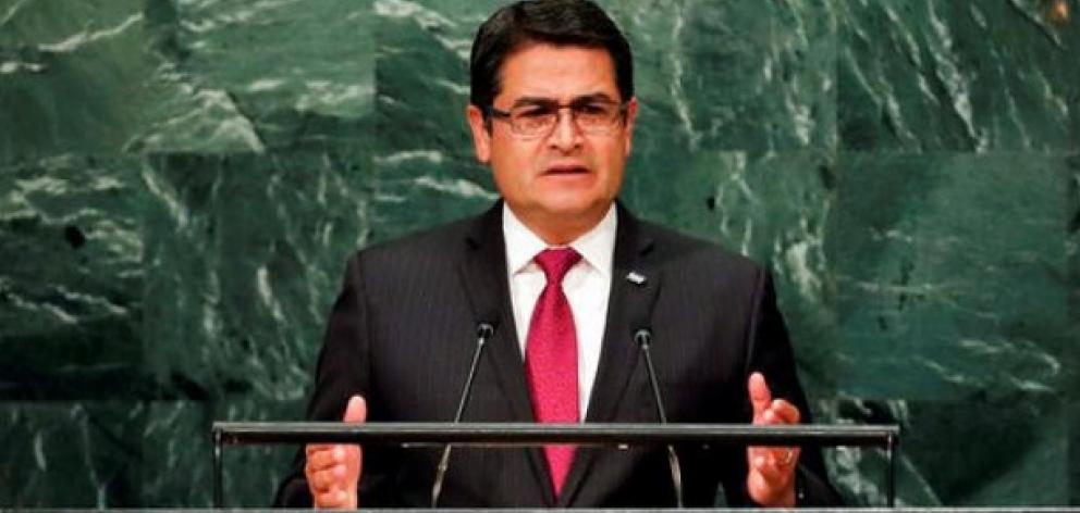 An investigation is looking into a drug cartel plot to kill Honduras' President Hernandez (above)...
