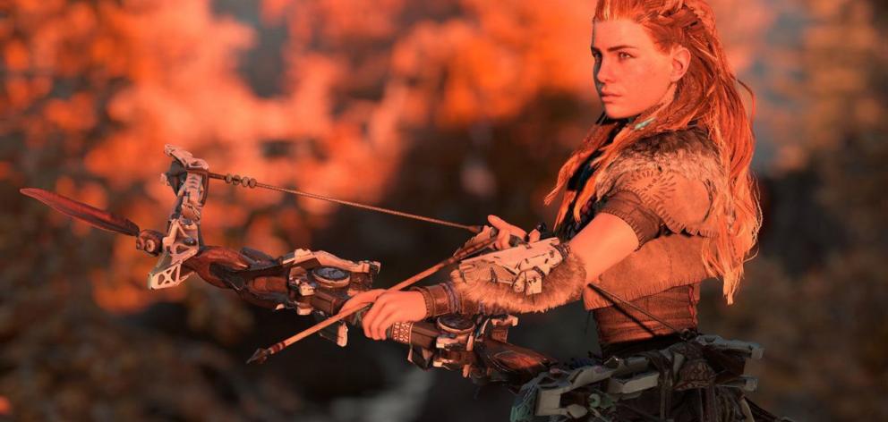 You play as Aloy (above), an outcast from the Nora tribe of humans, beginning the game as a child with your protector/mentor Rost. Photo: Supplied