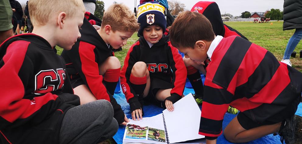 The C Pups read their Bread and Butter book together. Photo: Supplied