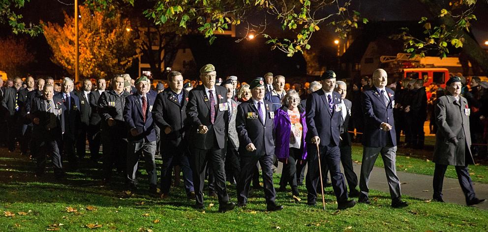 War veterans and their families marching into Cranmer Square during the dawn parade. Photo:...