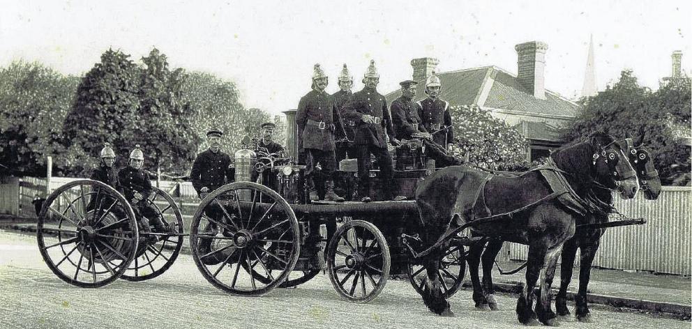 Members of the Rangiora Volunteer Fire Brigade with their steam powered pump in the early years....
