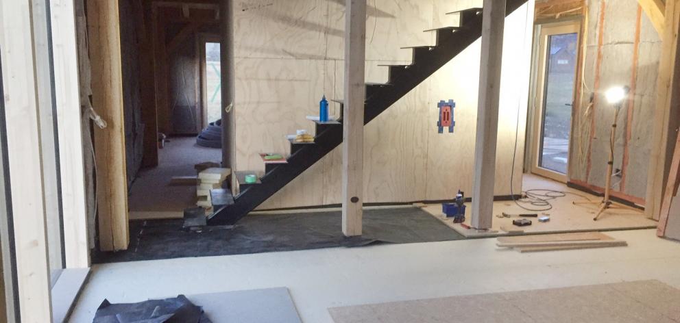 The centre of the house has a floating metal staircase.













