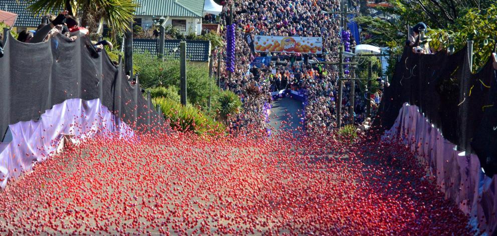 Thousands turn out to watch the annual Jaffa race down Baldwin St. Photo: Gerard O'Brien