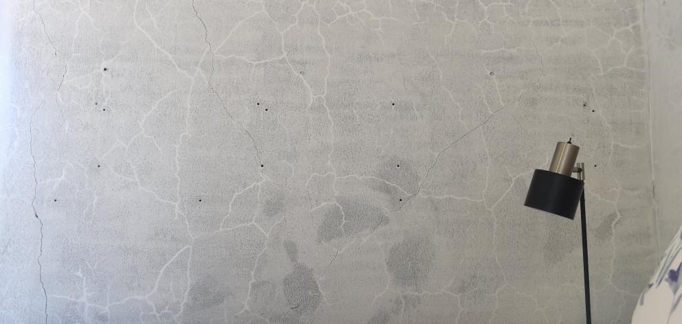 An interior concrete wall. 