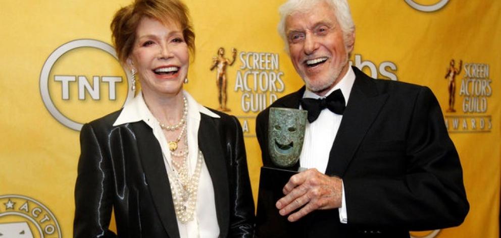 Mary Tyler Moore poses backstage after accepting the Lifetime Achievement Award from presenter Dick Van Dyke at the 18th annual Screen Actors Guild Awards. Photo: Reuters