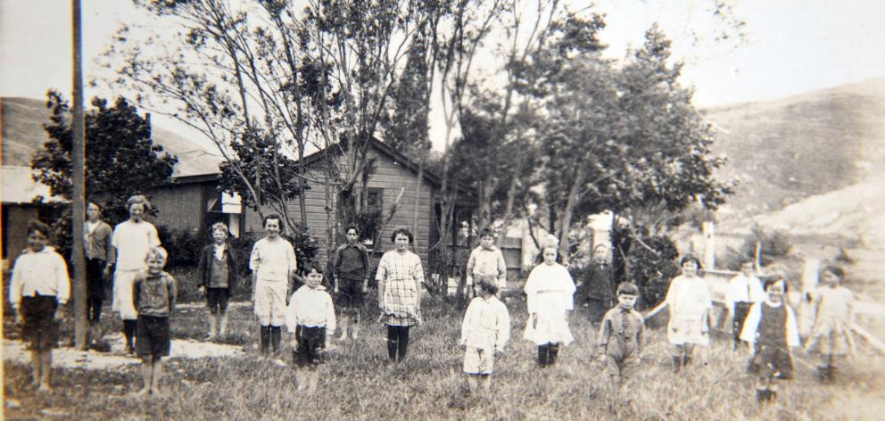 The Nevis School and its pupils in 1924 or 1925. Lessons were held in a converted cottage after...